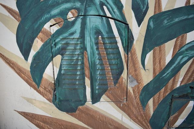 Watercolor Dinosaur Decals: Mixing Green Dinosaurs, Monstera Leaves, and Neutral Furniture