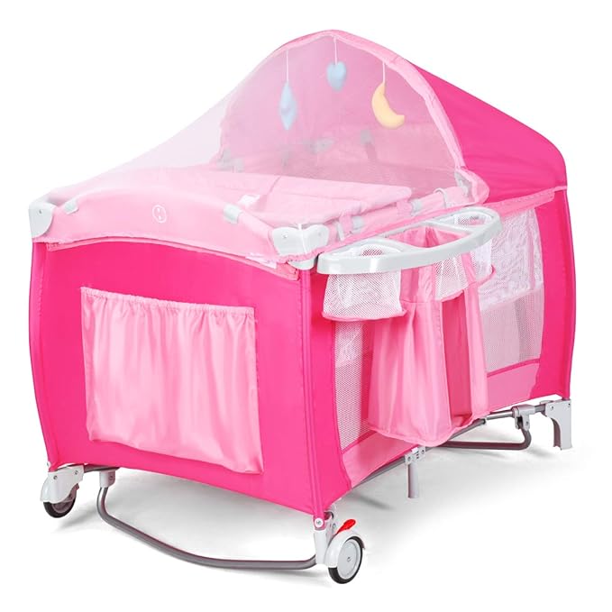 Costzon 4 in 1 Pink Pack and Play with Bassinet, Portable Baby Playard with Adjustable Canopy, Side Zipper Entrance, Music Box, Wheels/Brake, Foldable Infant Pink Bassinet for Baby Girl Toddlers